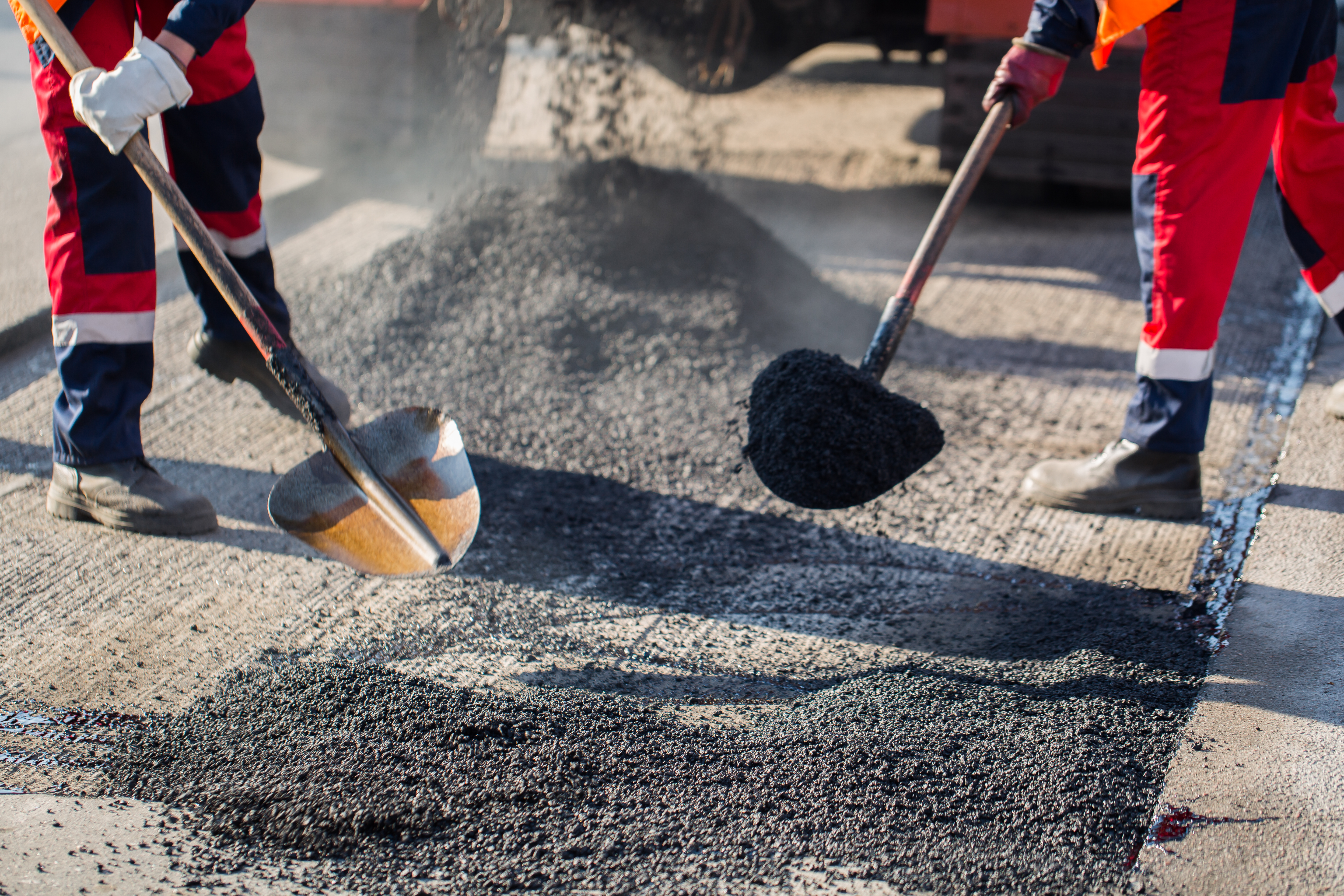 Street resurfacing. Fresh asphalt construction. Bad road